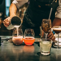 a person pouring drinks