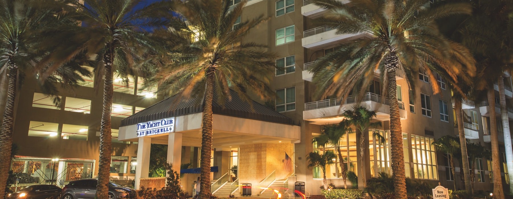 a street with palm trees and buildings