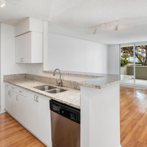a kitchen with white cabinets