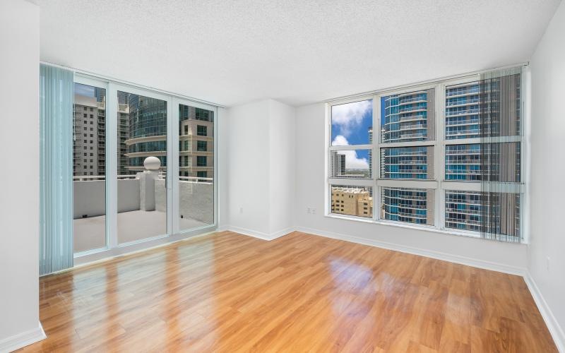 a room with a wood floor with a window